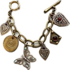 Vintage Heart Charm Dangle Jewelry, Brass Charm Bracelet Jewelry, Brass Bracelet With Charms, Unique Metal Charms Jewelry, Antique Style Bracelets With Dangling Charms As Gift, Heirloom Style Vintage Charm Bracelet As Gift, Antique Metal Jewelry With Heart Charm, Antique Bracelets With Dangling Charms As Gift, Heirloom Style Vintage Charm Bracelet For Gift