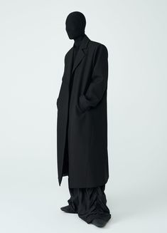 Discover the ultimate in style and comfort with The Shadow Overcoat. This unisex, loose-fitting overcoat features padded boxy shoulders and an oversized design. Made from a blend of wool, cotton, and polyester, it offers a minimal aesthetic without buttons. The wind-resistant material makes it perfect for autumn and winter. Available in black and in sizes Small to Extra Large. Size Chart: Size (CM) Length Sleeve Chest Shoulder Small 119 62.5 102 47 Medium 122 64 106 48 Large 125 65.5 110 49 Extr Classic Oversized Long Coat, Oversized Classic Long Coat, Oversized Long Wool Coat For Work, Classic Long Oversized Wool Coat, Classic Oversized Long Wool Coat, Oversized Long Classic Wool Coat, Oversized Solid Wool Coat For Work, Modern Oversized Outerwear For Work, Oversized Winter Business Outerwear