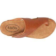 These wedges will be your go to all summer long. The Taos Loop is a casual women's leather thong style sandal with an adjustable strap and stylish wedge heel. These Taos Loop Brandy Leather Women's Sandals have the following features: Upper Material - Leather Arch and Metatarsal Support Footbed Lining - Suede Forefoot Cushioning Hook and Loop Closure Leather Lining Outsole - Flexible, durable rubber Heel Height - 1 3/4" LOP-4705 Baggallini Bags, Athleisure Sneakers, Leather Sandals Women, Flip Flop Shoes, Trail Shoes, Taos, House Shoes, Rubber Heels, Leather Items