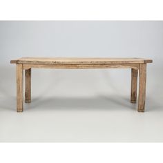 a wooden bench sitting on top of a white floor