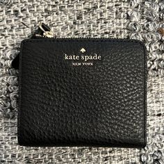 New With Tags. No Flaws. Fast Shipping Kate Spade Bifold Coin Purse, Kate Spade Compact Wallet For Everyday, Kate Spade Compact Everyday Wallet, Black Leather Compact Coin Purse, Versatile Black Wallet Perfect For Gifts, Versatile Black Wallet Perfect As Gift, Trendy Black Bifold Coin Purse, Versatile Black Wallet As Gift, Compact Black Leather Coin Purse