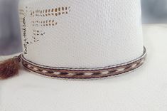 Cowboy hat band, genuine horsehair hat band, Five Strands wide ( 5/8 inch) BOLDLY done in a a natural brown-rich black and off-white Double horse hair tassels, Oh So Stetson perfect, **VERY Distinctive look **OUTSTANDING QUALITY ** STETSON perfect ** LUXURIOUS 100% genuine horsehair ** 5/8 inch wide. You will quickly discover that nothing compares to this extraordinary beauty: This horsehair hat band DEMANDS attention. This beauty is a 5 strands wide. Each strand is about 1/8 inch wide, separate Elegant Brown Hat Band For Ranch, Classic Cream Hat Bands For Ranch, Adjustable Cream Hat Bands For Western-themed Events, White Adjustable Hat With Flat Crown, White Adjustable Flat Crown Hat, Classic White Hat Bands For Rodeo, Classic White Hat Band For Rodeo, Fitted White Hat Bands For Country Events, White Fitted Hat Bands For Country Events