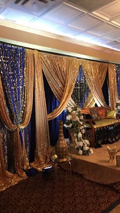 a banquet hall decorated in gold and blue