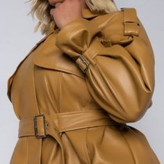 The Plus Azalea Wang Keeping It Short And Classy Pleather Crop Trench Is Made From A Vegan Leather Fabrication, And Is Complete With A Cropped Length, Front Flap Detail, Epaulette Shoulder Detail, A Collared Neckline, Two Side Pockets, Buckle Wrist Details, Waist Belt, And A Front Zipper Closure. - 94% Polyester 6% Spandex - Hand Wash Cold Yellow Leather Long Sleeve Outerwear, Yellow Leather Jacket With Long Sleeves, Chic Mustard Outerwear For Work, Yellow Leather Winter Outerwear, Yellow Leather Jacket For Fall, Yellow Long Sleeve Leather Jacket, Chic Mustard Outerwear For Fall, Yellow Long Sleeve Leather Jacket For Fall, Yellow Leather Jacket For Spring With Long Sleeves