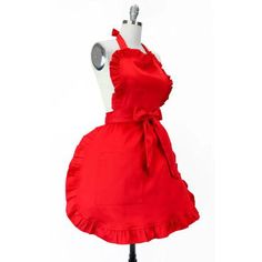 a red dress on a mannequin with a white background