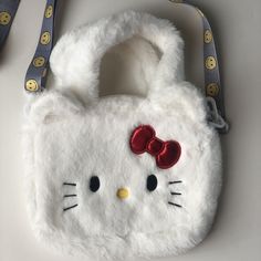 This Adorable Hello Kitty Crossbody Bag Is Perfect For Any Fan Of The Beloved Cartoon Character. Measuring 9 Inches In Width, 7 Inches In Height, And 6 Inches In Depth, It Provides Ample Space For All Your Essentials. The Bag Features A Zip Closure And Is Made Of High-Quality Materials, With A White Exterior And Matching White Hardware. The Plush Material Adds A Fun Touch To The Bag's Design, And The Cute Hello Kitty Logo Is Sure To Turn Heads. Ideal For Women Of All Ages, This Crossbody Bag Can Kawaii White Crossbody Shoulder Bag, White Kawaii Shoulder Bag, Portable White Kawaii Shoulder Bag, White Portable Kawaii Shoulder Bag, Kawaii White Shoulder Bag, Kawaii White Pouch Bag, Cute White Pouch Shoulder Bag, Cute White Bags For Daily Use, White Shoulder Bag With Cat Design For Gift