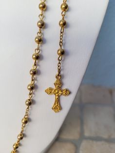 "A beautiful vintage gold tone rosary necklace of Our Lady Fátima (Portugal). In metal / brass and with the beads in metal or hard plastic (not sure) painted. The beads have a lovely dark gold tone. The necklace has a clasp. Condition: As found. In good vintage condition, although it has signs of having been previously loved (please see photos carefully). The clasp works well. Measures: necklace 66cm / 26\"IN top/down 45cm / 18\"IN cross 2,8cm / 1 1/8\"IN beads/each 4mm Weight: 11 grams Shipping Gold Rosary, Lady Of Fatima, Holy Rosary, Sainte Marie, Rosary Necklace, Holy Mary, Rosary Catholic, Rosary Beads, Dark Gold