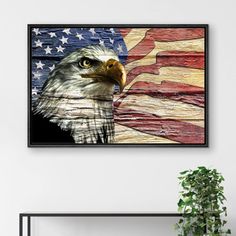 an eagle with the american flag on it's back is hanging above a shelf