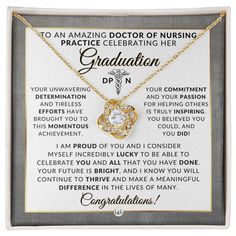 a gold necklace with the words graduation written on it and an image of a heart