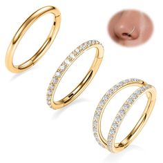 three different types of gold rings with diamonds on the bottom and one in the middle