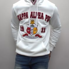 Show your love for Kappa Alpha Psi with this stylish cream colored hoodie. Perfect for members of the Fraternity, this hoodie is a great addition to any collection. The design features the iconic Kappa Alpha Psi logo, making it a must-have for any NUPE Stay warm and comfortable in this high-quality hoodie, perfect for casual wear or representing your fraternity at events or gatherings. The cream color adds a touch of sophistication to the design, making it versatile enough to wear with any outfi White Hooded Fan Apparel Top, Hip Hop Style College Sweatshirt With Drawstring Hood, Hip Hop Style Sweatshirt With Drawstring Hood For College, Hip Hop College Hoodie, White Hip Hop Fleece Hoodie, White Hip Hop Hoodie Sweatshirt, White Hip Hop Style Hoodie Sweatshirt, White Hoodie For College In Fall, White Winter Hoodie For College