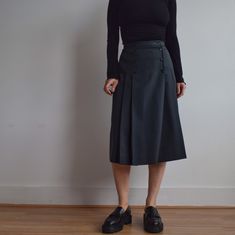 Vintage wool midi skirt. Great vintage condition. Made in UK by Country Casual in early 80's. Beautiful shade of khaki green. Button closure at the front. Fully lined. Great fit. Originally women's size S depending on desire fit but please check measurements carefully as there is no size tag. Classic. Waist 66cm=26' Total length 69cm=27' Model is 164cm=5'4 tall UK size 10. Khaki Midi Skirt For Fall, Vintage Knee-length Winter Bottoms, Vintage Knee-length Bottoms For Winter, Vintage Midi Skirt Bottoms For Fall, Vintage Midi Skirt For Fall, Vintage Winter Skirt With Buttons, Green Midi Length Bottoms For Fall, Green Midi Length Workwear Bottoms, Vintage Knee-length Bottoms With Buttons