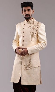 Details : Color -Cream Any Color you may ask for...(one colour) Fabric Important Fabric Work Details ;Embroidery Bottom Details -marron- Pajama Package Include : Top , Bottom,, All others accessories are for photography purpose only . Just the Top and bottom available . Color variation may be there slightly , due to computer resolution and camera . Beige Raw Silk Sherwani With Dabka, Beige Sherwani With Resham Embroidery For Transitional Season, Beige Sherwani With Resham Embroidery, Festive Beige Set With Gold Embroidery, Beige Raw Silk Sherwani With Zari Work, Transitional Beige Bandhgala With Intricate Embroidery, Fitted Beige Set For Reception, Transitional Beige Sherwani With Intricate Embroidery, Beige Reception Set