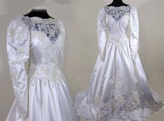 two wedding gowns on mannequins, one in white and the other in blue