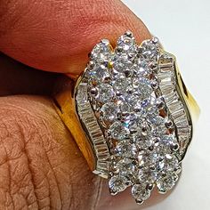 Huge 2.50 Carat Simulated Diamond Cluster 14K Yellow Gold Cocktail Ring,Bridal Set Ring,925 Sterling Ring,Baguette Diamond Ring Product Information Cut: Very Good Diamond Lab Created( Simulated)Total Ct Wt : 2.50 Ct. Gold metal: 14k Solid Gold Diamond Shape: Round  and Baguette Clarity: VVS1 Color: D Main Stone Color: White Cut: Very Good Diamond Lab Created(simulated) Brand: Tishya Jewellers Total Ct Wt : 2.50 Ct. Gold metal: White (925 Sterling Silver Solid ),Rose Gold Plated,Yellow Gold Plated Diamond Shape: Round  and Baguette Clarity: VVS1 Color: D Main Stone Color: White Diamond :Lab Created(Simulated) Brand :Tishya Jewellers Metal: Metal :925 Sterling Silver On that High Gold Plating Done 14kYGFN+LAB Crearted      14K Yellow Gold Finish(Base metal Sterling Silver)+Lab Created Diamon Dazzling Baguette Diamond Cluster Rings, Dazzling Cluster Baguette Diamond Rings, Dazzling Cluster Rings With Baguette Diamonds, Dazzling Baguette Diamond Ring For Anniversary, White Marquise Cut Rings With Baguette Diamonds, Gold Cluster Rings With Baguette Diamonds, Classic Cluster Baguette Diamond Rings, Dazzling Baguette Cut Anniversary Rings, Silver Cluster Ring With Baguette Diamonds For Anniversary