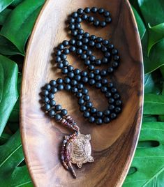 ☾ Created with natural, Ethically-sourced gemstones:  BLACK ONYX  Courage, Strength, Resiliency, Release of the Old & New Beginnings ✸ 8mm Ethically-Sourced Matte Black Onyx 108 beads ✸ Vintage Copper Buddhist LP Liew Rai Taeng Thong Prosperity Turtle Amulet*, Made & Blessed in Thailand * Please note, this amulet is quite a bit larger & heavier than the other amulets on our malas. It's a stunning and really sturdy piece. ✸ Natural Garnet, Fair Trade Recycled Copper & Czech glass accent beads at Amulet Style Jewelry With 8mm Beads For Meditation, Amulet Jewelry With 8mm Beads For Meditation, 8mm Beads Amulet Jewelry For Meditation, Nature-inspired Healing Jewelry With 8mm Beads, Holistic Agate Jewelry With 108 Beads, Black Spiritual Beaded Bracelets For Meditation, Handmade Black Beaded Bracelets, Obsidian Beaded Jewelry For Healing, Handmade Holistic Black Beaded Bracelets