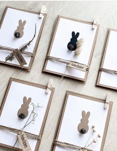 four cards with different designs on them sitting on a table