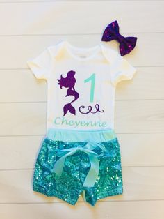 "This bodysuit is perfect for any mermaid themed Birthday. Made with our beautiful no shed glitter its sure to be a hit! We offer design color changes upon request. Please add name into the order notes Bodysuit: Carters (100% Cotton) Washing Instructions: Turn inside out, wash on a cold cycle, tumble dry low or hang to dry. Don't forget to LIKE us on Facebook! {https://www.facebook.com/Paytonspinkboutique/} Sequin shorts {If ordering the \"Bodysuit & Short SET\"}: How to order: Please put th Pink Sequin Shorts, Little Mermaid Outfit, Mermaid Party Invitations, Mermaid Birthday Outfit, Mermaid Birthday Party Invitations, Mermaid Tutu, Mermaid Invitations, Mermaid Outfit, Little Mermaid Birthday