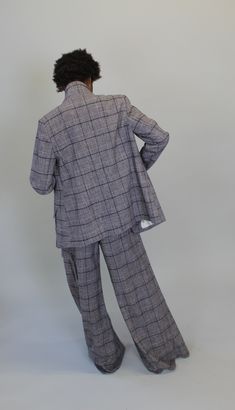 Italian recycled yarn dye plaid blazer with lapel button at wearer's left below collar. Inseam pockets. Back vent and button closure at CB sleeves. Blazer measures 27" from HPS. Tailored Plaid Blazer With Patch Pockets, Tailored Plaid Suit With Pockets, Plaid Blazer With Welt Pockets And Lapel Collar, Plaid Blazer With Lapel Collar And Welt Pockets, Tailored Plaid Tweed Jacket With Patch Pockets, Plaid Tweed Jacket With Welt Pockets And Lapel Collar, Tailored Plaid Outerwear With Patch Pockets, Plaid Blazer With Concealed Placket And Lapel Collar, Plaid Outerwear With Patch Pockets For Business Casual