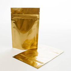 a gold foil bag sitting on top of a white surface