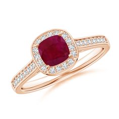 Drawing inspiration from elegant vintage patterns, the cathedral set ruby ring is crafted in 14k rose gold. The bold red ruby is surrounded by a halo of glimmering diamonds. Additional pave set diamonds on the shank and bezel set diamonds on the gallery lend a glamorous element to this cushion ruby ring. Classic Cushions, Contemporary Ring, Vintage Diamond Rings, Ring With Diamond, Bezel Set Diamond, The Cathedral, Ruby Earrings, Red Ruby, Classic Ring