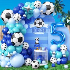 a soccer themed birthday party with balloons and decorations