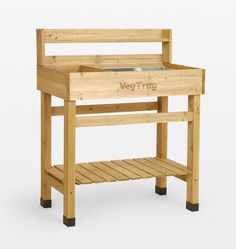 a wooden table with a glass top and shelf on the bottom that says veggtag