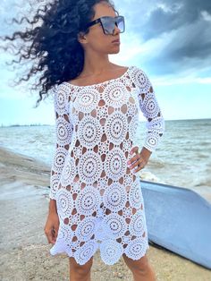 Long Crochet Dress For Beach Season Cover-up, Crochet Lace Cover-up For Vacation, Bohemian Hollow Out Dress For Beach Cover-up, Bohemian Open Knit Dress, Bohemian Open Knit Summer Dress, White Beachy Lace Dress, Long Sleeve Hollow Out Beachwear Dress, White Crochet Beachwear Cover-up, White Crochet Beach Cover-up Dress