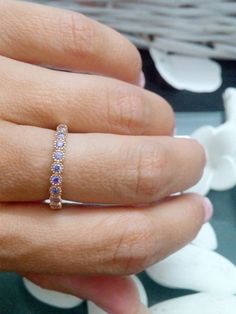 This ring features a delicate small Lavender crystal gemstones set in 14k gold filled ring. => Gemstone Type - Lavender crystal => Gemstone Size - 2.25 mm * 10 => Gemstone Cut - Faceted => Metal Type - 14k Gold Filled (Tarnish Resistant And Nickel Free) - also available in 925 sterling silver ♦ Replace the gemstones with many other gemstones we have in stock: Mystic Topaz Moonstone Onyx Amethyst Alexandrite Garnet Aquamarine Clear Quartz Lab grown Emerald Lab grown Ruby Peridot Lab g Delicate Rose Gold Stackable Cubic Zirconia Rings, Delicate Rose Gold Cubic Zirconia Crystal Ring, Rose Gold Dainty Crystal Ring With Cubic Zirconia, Dainty Rose Gold Crystal Ring With Cubic Zirconia, Dainty Rose Gold Cubic Zirconia Crystal Ring, Dainty Rose Gold Crystal Ring With Birthstone, Dainty Rose Gold Cubic Zirconia Birthstone Ring, Dainty Rose Gold Crystal Birthstone Ring, Dainty Rose Gold Stackable Crystal Ring