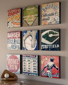 four baseball signs are hanging on the wall above a table with a baseball glove and mitt