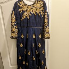 It Is A Beautiful Navy-Blue Embroidered Anarkali Dress. High Embroidered Sequined Work On The Dress. Dupatta And Pant (Pajama) Are Included. Used Only Once (Just Like Brand New). No Return Is Accepted. Maxi Length Salwar Kameez With Intricate Embroidery For Navratri, Floor-length Embroidered Choli For Eid, Embroidered Floor-length Choli For Eid, Festival Floor-length Salwar Kameez With Intricate Embroidery, Floor-length Embroidered Salwar Kameez For Festivals, Traditional Floor-length Anarkali Set With Floral Embroidery, Traditional Floor-length Anarkali With Floral Embroidery, Bollywood Style Floor-length Salwar Kameez With Intricate Embroidery, Anarkali Salwar Kameez With Intricate Embroidery For Diwali