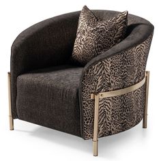 a leopard print chair with two pillows on it's back and gold frame legs