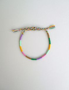 "Thin rope bracelet Cotton perle thread Surfer bracelet Blue and Green Friendship jewelry Beach jewelry Summer gift ideas Wrist wrap bracelet This colorful wrapped bracelet is made with teal,pink,orange,lime,olive and red cotton perle thread. It is ended with two braids that are tied together to secure the bracelet. Width: 0.2 cm / 0.08 \" More friendship bracelets in my shop: https://www.etsy.com/shop/LuckyRatJewellery?section_id=15213457&ref=shopsection_leftnav_1 *Colours may differ slight Inspiring Bracelets, Rope Friendship Bracelet, Thread Wrapped Bracelets, Bracelet Cotton, Summer Gift Ideas, Yarn Bracelets, Cute Friendship Bracelets, Summer Beach Jewelry, Thread Bracelet