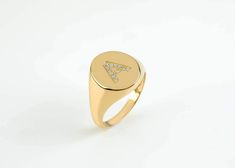 This trendy initial diamond ring is made of solid gold. You can set with diamonds your favourite letter as all letters are available ( or numbers) and create your personalized signet ring. The possibilities to engrave it are endless, your initials, your beloved s initials, your kids, etc. ✔ Made to Order ✔ Gold Kt: 9k-14K-18k ✔ Available Gold Color: Rose Gold, Yellow Gold, White Gold ✔ Gemstone: Genuine Diamonds, or other genuine gemstones ✔ Stone Cut: Round ✔ Number of Stones: 12 (depended on t Romantic Rings, Gold Anniversary, Gold Signet Ring, Initial Ring, Solid Gold Jewelry, Romantic Gift, Signet Ring, Diamond Rings, Colored Diamonds