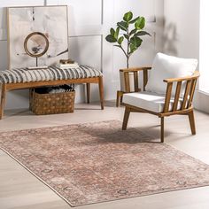 a living room with two chairs, a rug and a potted plant in the corner