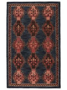 a blue rug with red and black designs on the bottom, along with an orange border