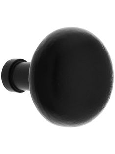 a black door knob on a white background with the top half turned to look like a ball