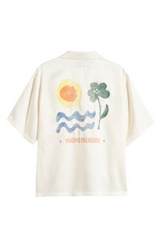 Colorful flowers pair with sun-and-surf artwork on a camp shirt made of silky lyocell and styled to keep you relaxed on warm, casual days. 27 1/2" length; 48" chest (size Medium) Front button closure Convertible collar Short sleeves 100% lyocell Machine wash,  dry flat Imported Surf Artwork, Convertible Collar, Summer Wardrobe Essentials, Wedding Guest Shoes, Pacific Palisades, Sneaker Slippers, Camp Shirt, Pajama Robe, Sports Blazer