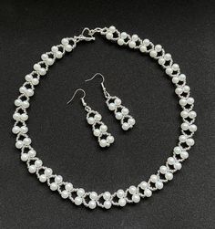 "White Glass Pearl Necklace Set   Pearl & Seed Bead Glass Set Necklace  & Matching Earrings Elegant Vintage Design     6mm white glass pearls     11/0 silver seed beads     Strung in flowing design     Necklace  measures 16\" in length     With Heart shaped T-bar     Earrings in a drop design     Silver  plated hooks   This design can be altered in length to suit needs Like it but in a different colour? Please just send me a message" Pearl Bead Patterns Necklace, Elegant Beaded Earrings, Beaded Metal Pearl Necklace With Round Beads, White Metal Beaded Necklaces With Round Beads, Party Pearl Jewelry Sets In Silver, Party Pearl Silver Jewelry Sets, Silver Pearl Jewelry Sets For Party, Party Silver Pearl Jewelry Sets, Silver Beaded Pearl Jewelry