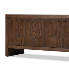 the sideboard is made out of wood and has four doors on one side, with three