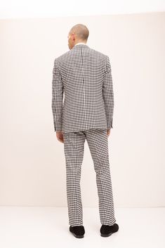 DETAILS The black and white color combination of this suit not only compliments each other, but as well as keeping it as the classic and versatile choice for a formal or special event. This type of suit, the double-breasted style, features two columns of buttons, one on each side, and overlapping front flaps. In company with the houndstooth design, it makes this timeless outfit look stunning. Exclusively handcrafted by Ron Tomson. The suit consists of a suit jacket and a pair of pants. Pants hav Houndstooth Suit, Types Of Suits, Turkey Style, Timeless Outfits, Matching Pants, Black And White Colour, Pair Of Pants, Los Angeles California, Color Combinations