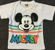 Vintage 80s Mickey Mouse Collection baby Shirt In sz. S 4. Spotting/wear as pictured. Made in the USA. Single stitch sleeve and hem. See pictures for condition. ******PLEASE MAKE SURE YOU READ AND UNDERSTAND THESE GUIDELINES****** ALL SALES FINAL so understand what you are purchasing. The pictures in this listing and the description are all part of the item description so make sure you have examined all measurements, photos, and flaws prior to purchasing.   I DON'T GIVE REFUNDS IF SOMETHING DOES Mickey Mouse Pop Culture Short Sleeve Tops, Vintage Mickey Mouse Tshirt, Retro Mickey Mouse Short Sleeve Tops, 80s Mickey Mouse, Cheap Mickey Mouse Pop Culture T-shirt, Baby Shirts, See Picture, Walt Disney, Disneyland