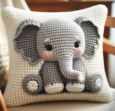 a crocheted pillow with an elephant on it