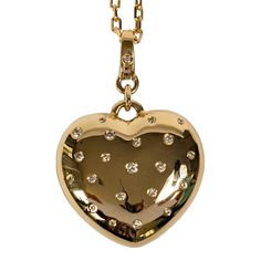 This is part of Chairish’s Fine Jewelry assortment.  At Rocks with Soul, we are a bit obsessed with hearts. Therefore we created a beautiful heart charm that can attach to any longer chain (we recommend putting this on a 22 or 24 inch chain. This one has diamonds for an extra happy statement.  14K Gold; .38 Ct Full Cut Diamond; ; 32x28 mm  Please note: Chain not included with purchase of charm Luxury Heart-shaped Charms Necklace, Luxury Double Heart Charm Necklace, Luxury Heart Cut Necklace With Heart Charm, Luxury Heart Charm Open Heart Necklace, Luxury Open Heart Necklace With Heart Charm, Puffed Heart, Space Rock, Beautiful Heart, Long Chain