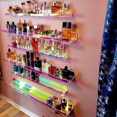 the shelves are filled with different types of perfumes