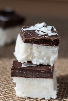 three pieces of chocolate and marshmallow ice cream stacked on top of each other