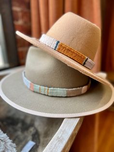 One of a kind hand woven hatbands in beautiful boho colors and patterns.  Hand woven by me on a wooden loom using luxurious fibers like linen, cotton, raw silk, bamboo and hand spun yarn. Perfect for that Fedora or summer straw hat . Price is per hat band. Standard fedora size (23 1/2 inches long) width is about 3/4 of an inch but can be woven to any size specifications. Always open to custom color & design ideas! You can shoot an email inquiring what is currently in stock, send me a screenshot Handwoven Natural Hat Band With Flat Brim, Artisan Handwoven Wide Brim Fedora, Adjustable Handwoven Fedora With Short Brim, Adjustable Handwoven Natural Color Hat Bands, Adjustable Handwoven Natural Hat Band, Artisan Handwoven Adjustable Straw Hat, Artisan Adjustable Handwoven Straw Hat, Bohemian Cream Hat Band For Beach, Bohemian Handwoven Natural Hat Band