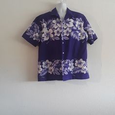 Vintage Kalena Fashions Of Hawaii Sz. Xl Purple Aloha Hawaiian Collared Shirt In Excellent Condition, Stored Away No Tags Tag Inside By Neckline Has Kalena Fashions Of Hawaii , Size Xl , 65% Polyester & 35% Cotton Shirt Has Purple Background & White Hibiscus Flowers And Aloha & Hawaii Print Throughout Fabric Buttons Down Front Left Side Has Pocket By Chest Area Cool Vintage Hawaiian Aloha Shirt! Purple Short Sleeve Shirt For Vacation, Fitted Floral Print Shirt For Vacation, Classic Floral Print Tops For Summer, Classic Tops With Floral Print In Relaxed Fit, Classic Tops With Floral Print And Relaxed Fit, Classic Top With Floral Print And Relaxed Fit, Classic Floral Print Tops With Relaxed Fit, Fitted Hawaiian Collared Top, Fitted Collared Hawaiian Top