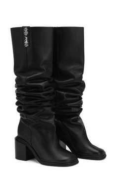 A slouchy shaft brings plenty of modern attitutde to a leather boot complete with polished signature hardware at the block heel. Exclusive retailer 3" heel Pull-on style Leather upper/textile lining/rubber sole Imported Slouchy Leather Boots, Rubber Sole Boots, Women Heel Boots, Naked Wolfe, Black Boots Tall, Tall Boot, Signature Hardware, Leather Boots Women, Leather Boot