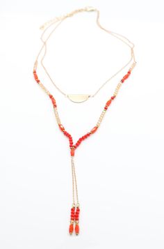 Bring some double the fun to your look with this dual-hued necklace! Featuring a mix of orange and champagne beads, you'll be striking a balance between sassy and chic! Wear with your favorite summer dress for a playful pop of color.Details: Fine Gold Chain Double Strand Necklace Orange and Champagne Colored Beads Length: 16" Extension: 2" Beads: 3mm - 4mm Summer Party Long Necklaces, Bohemian Faceted Beads Necklaces For Summer, Bohemian Necklace With Faceted Beads, Multi-strand Summer Jewelry For Party, Summer Bohemian Necklace With Faceted Beads, Gold Multi-strand Summer Jewelry, Gold Multi-strand Jewelry For Summer, Elegant Multi-strand Necklaces For Summer, Adjustable Long Orange Necklace